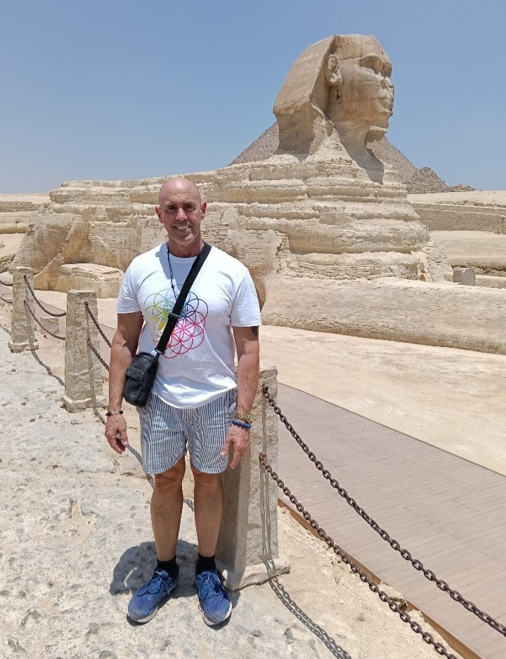 Steve Harmon standing in front of the Great Sphinx of Giza, Egypt